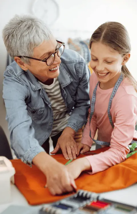 A grandmother and child creating something together